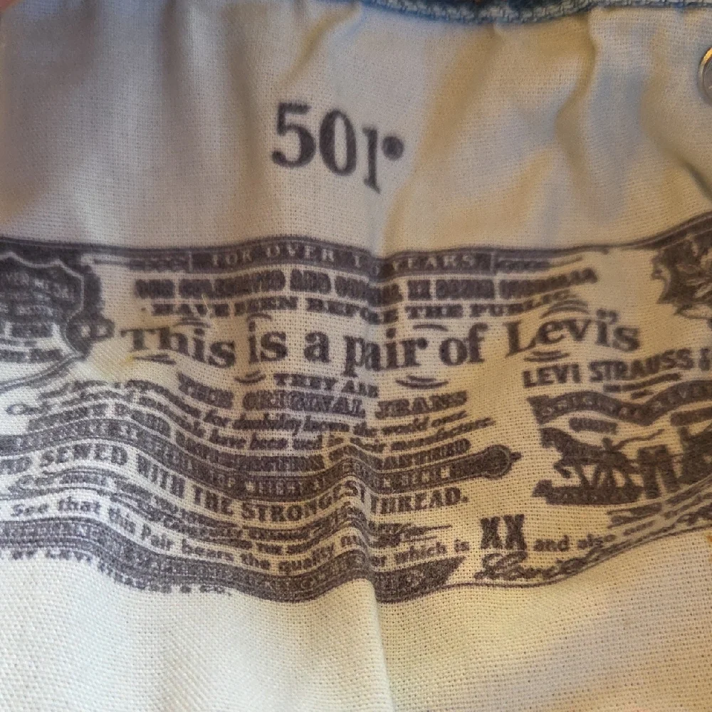 Levi's 501 Light Blue Distressed Jean Shorts‎